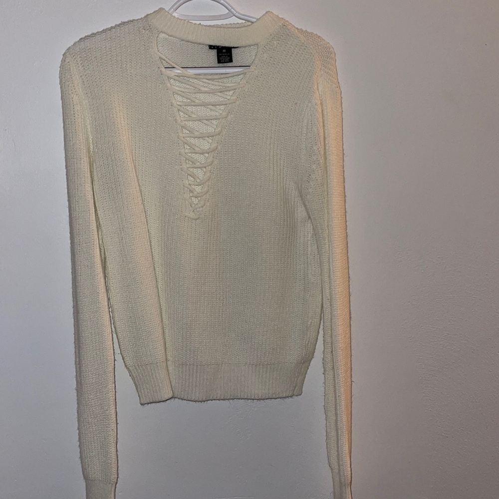 White low cut cross sweater